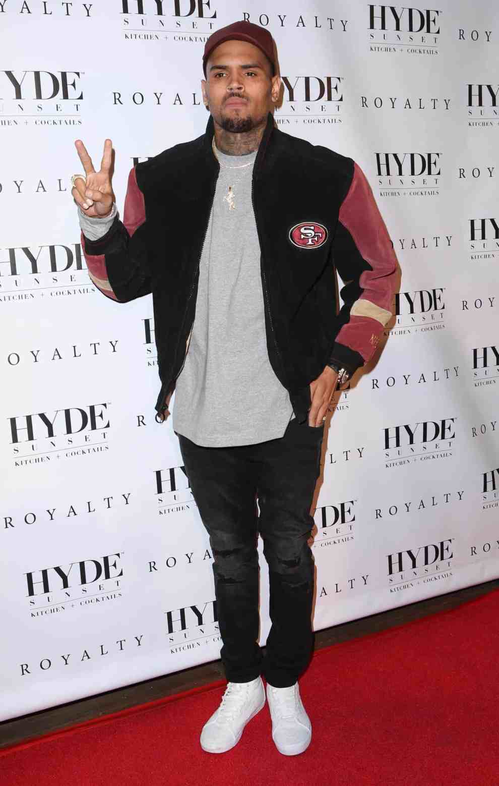 Chris Brown giving peace sign