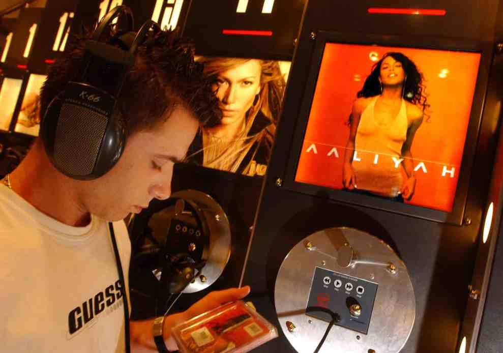 man listening to Aaliyah record