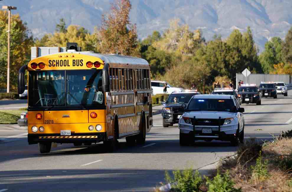 School bus escorted by police vehicles