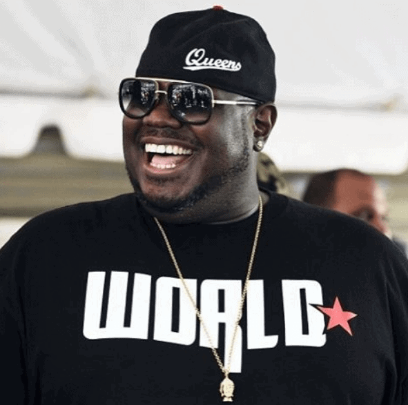 Q wearing Worldstar shirt