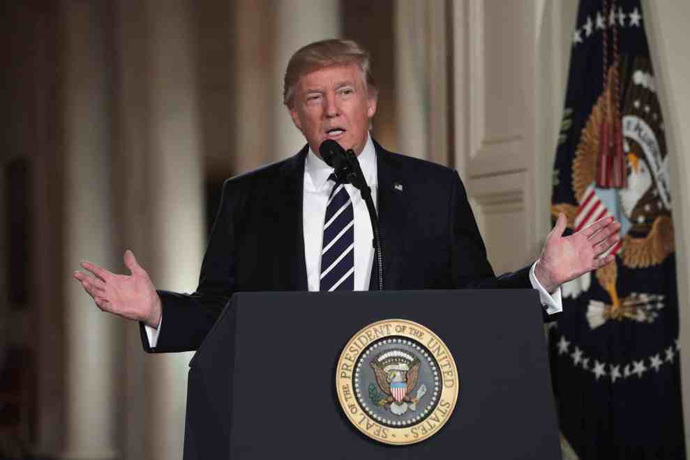 President Donald Trump behind Seal of the President of the United States