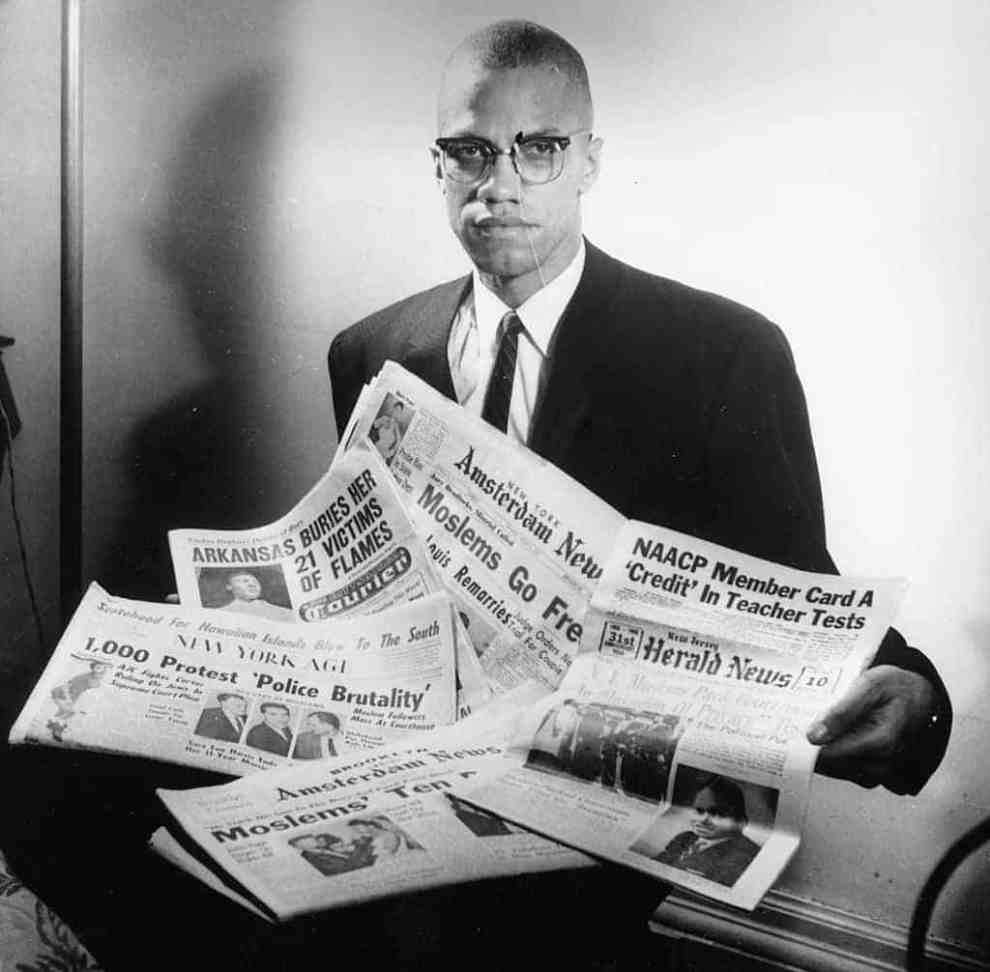 Malcom X with Newspaper headlines NAACP Member Card a Credit in Teacher Test