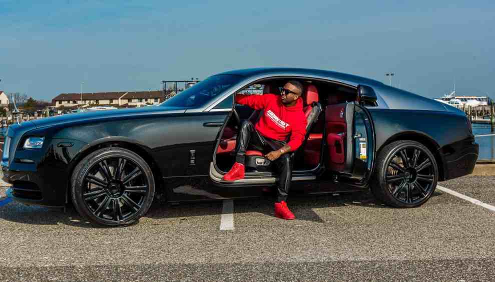 DJ Magic stepping out of black car