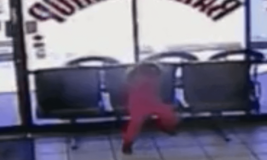 Video still of child sitting in barbershop