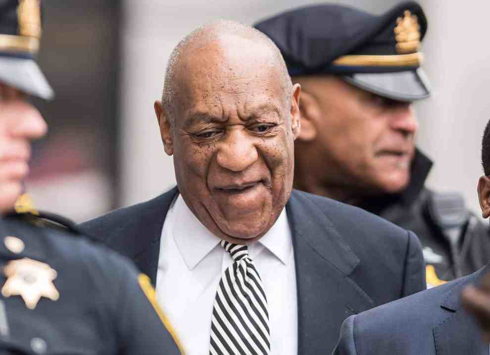 Bill Cosby surrounded by police