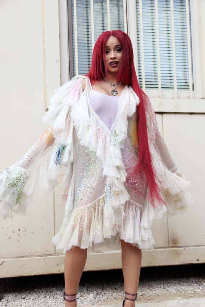 Cardi B with long red hair and white dress