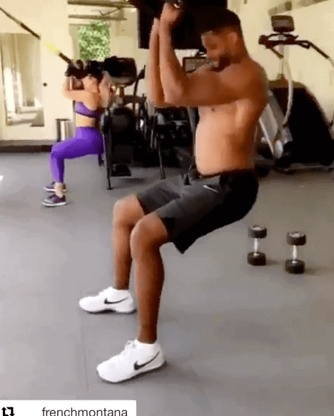 Screenshot from video of Khloe Kardashian and Tristan Thompson working out with weights