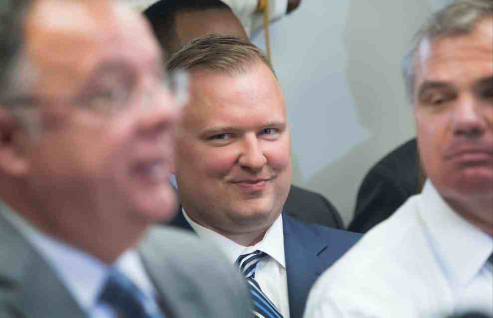 Baltimore Police officer Garett Miller grins during a press conference at the Fraternal Order of Police offices on July 27