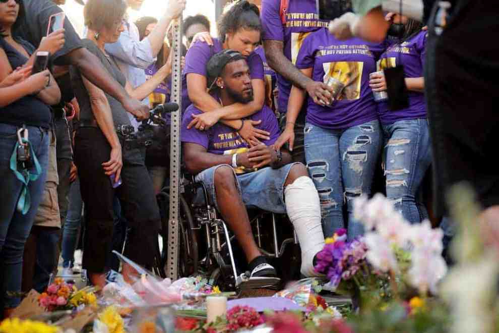 Marcus Martin and his wife Marissa Blair and friends visit the memorial August 13