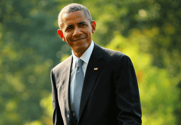 President Barack Obama waves to reporters after returning to the White House on board Marine One September 3