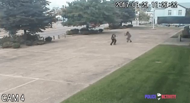 Screenshot from video of Police shooting man with bat