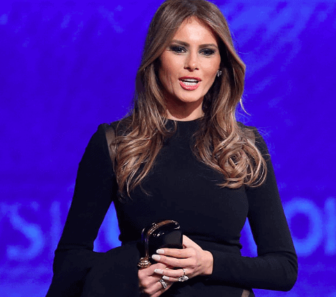 Melania Trump stands at the Republican presidential debate at St. Anselm College February 6