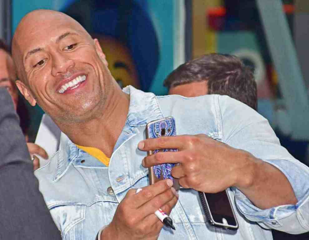 The Rock taking a picture with a fan at Baywatch European Premiere Party In Berlin