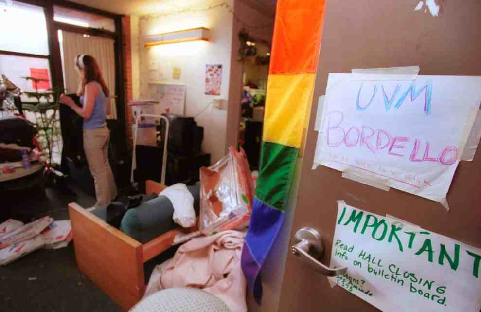 An unidentified student packs up her belongings from her dorm room for the end of the semester