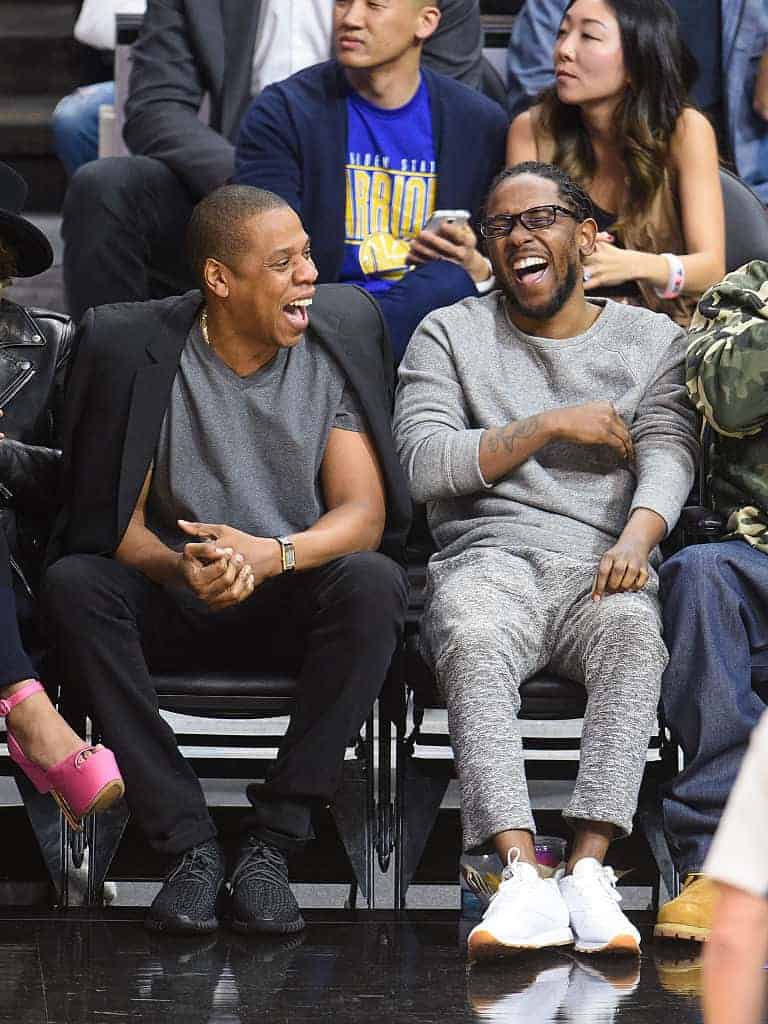 Jay Z and Kendrick Lamar attend a basketball game between the Golden State Warriors and the Los Angeles Clippers 2/20/16