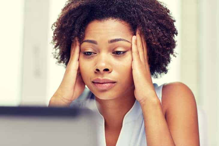 Woman staring at Laptop