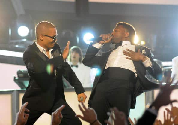 Kanye West performs with T.I.