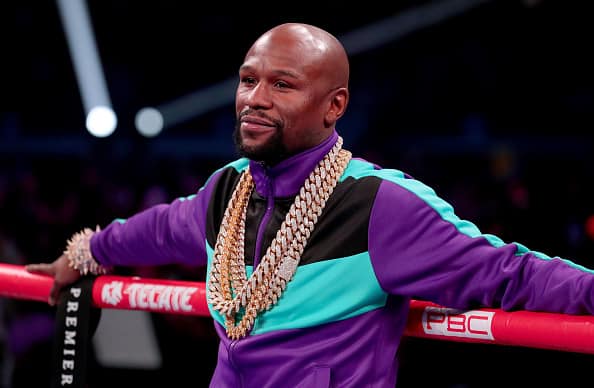 Floyd Mayweather Jr. stands in the ring before Errol Spence Jr takes on Mikey Garcia in an IBF World Welterweight Championship bout at AT&T Stadium on March 16