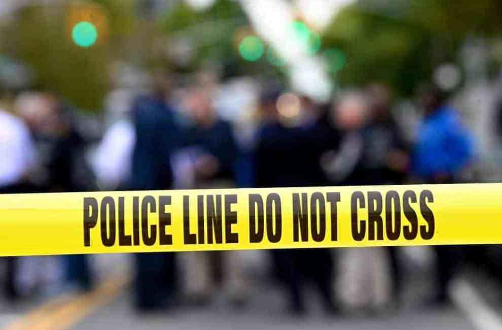 Police tape secures a crime scene outside a club after a shooting in Brooklyn on October 12