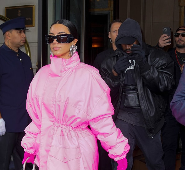Kanye West and Kim Kardashian head out of their hotel on October 09