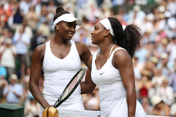 Venus Williams (USA) (L) embraces Sister