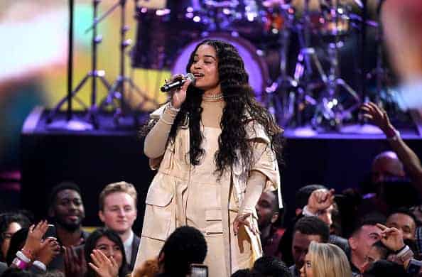 Ella Mai on stage performing.