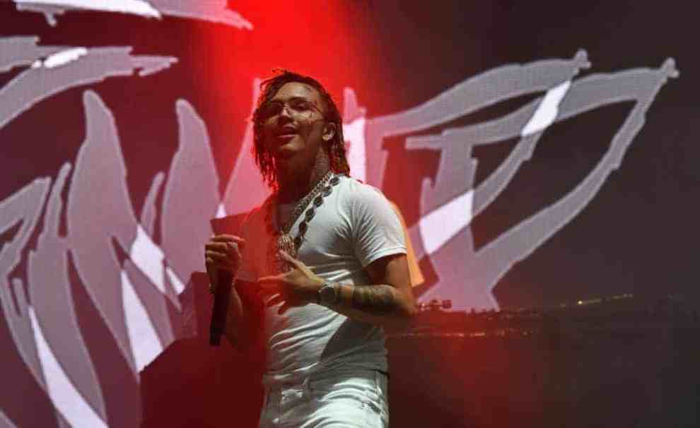 Lil Pump performing dressed in white wearing wire frame glasses