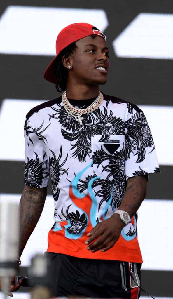 Rich The Kid wearing red and blue on stage