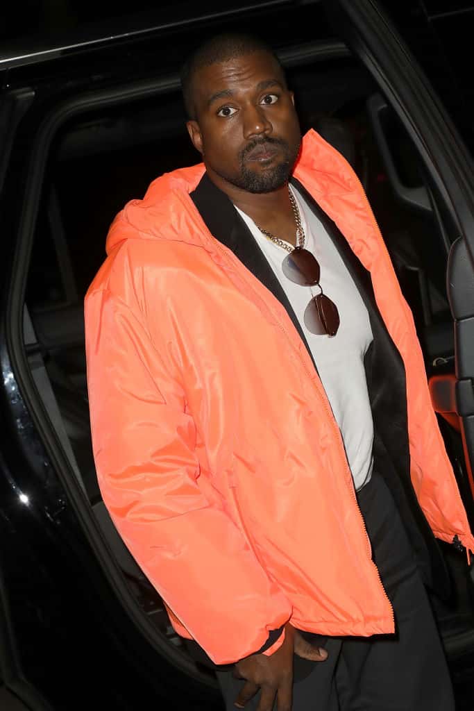 Kanye West wearing Orange Jacket
