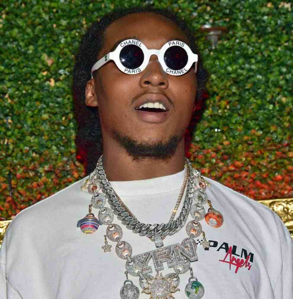 Takeoff wearing white sunglasses and white shirt with diamond chains