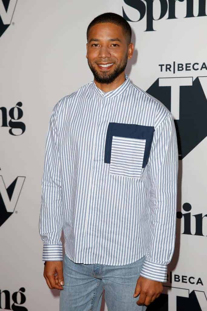 Jussie Smollett wearing a blue shirt