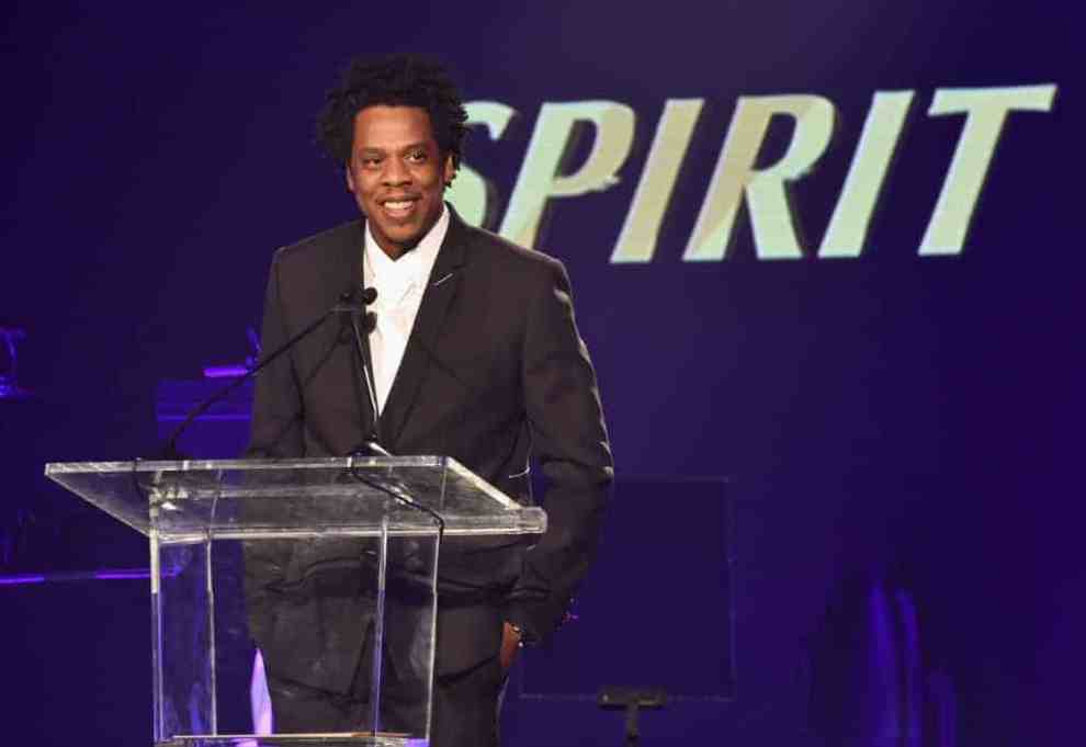 Jay Z wearing black and white on stage