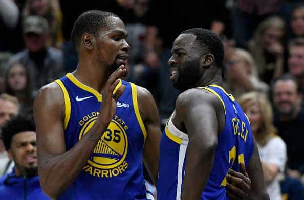 Kevin Durant #35 Golden State Warriors speaking to Draymond Green #22 of Golden State Warriors during game against the Clippers