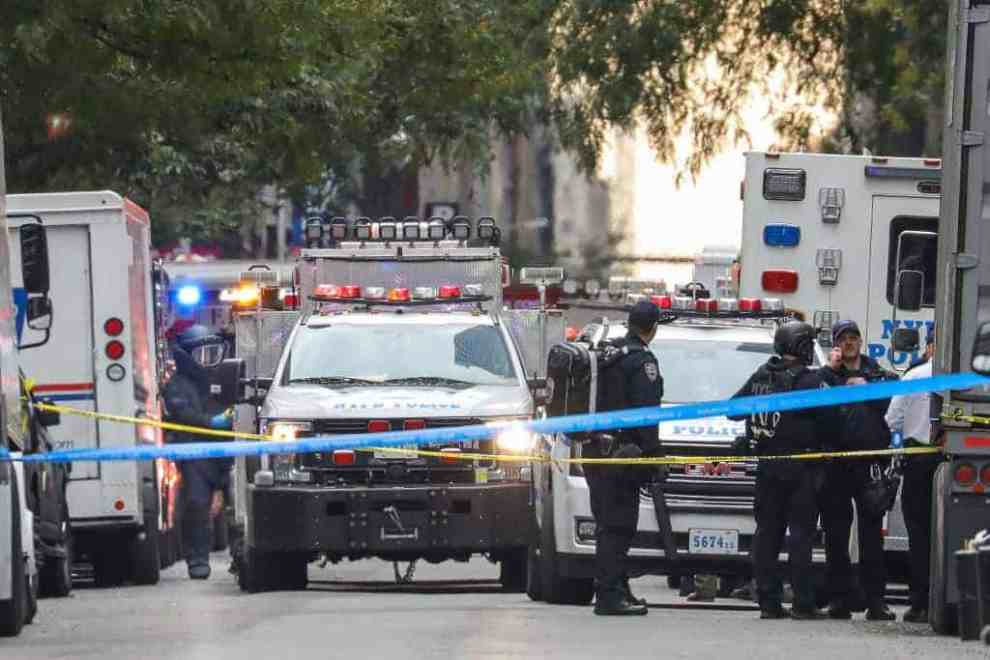 Ambulance and Police vehicles on taped off street