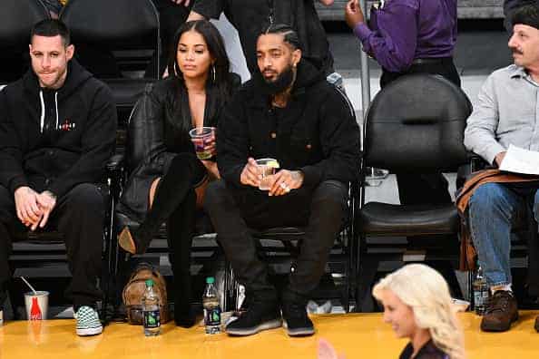 Nipsey Hussle and Lauren London attend a basketball game between the Los Angeles Lakers and the Portland Trail Blazers at Staples Center on November 14