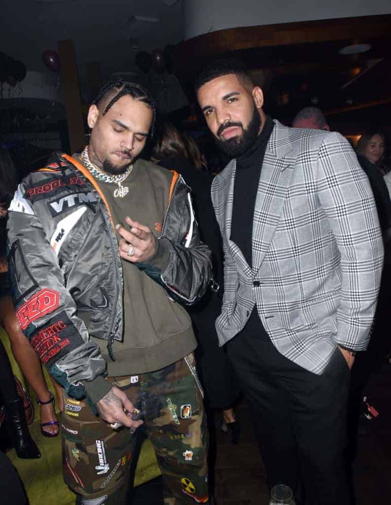 Drake and Chris Brown standing next to each other