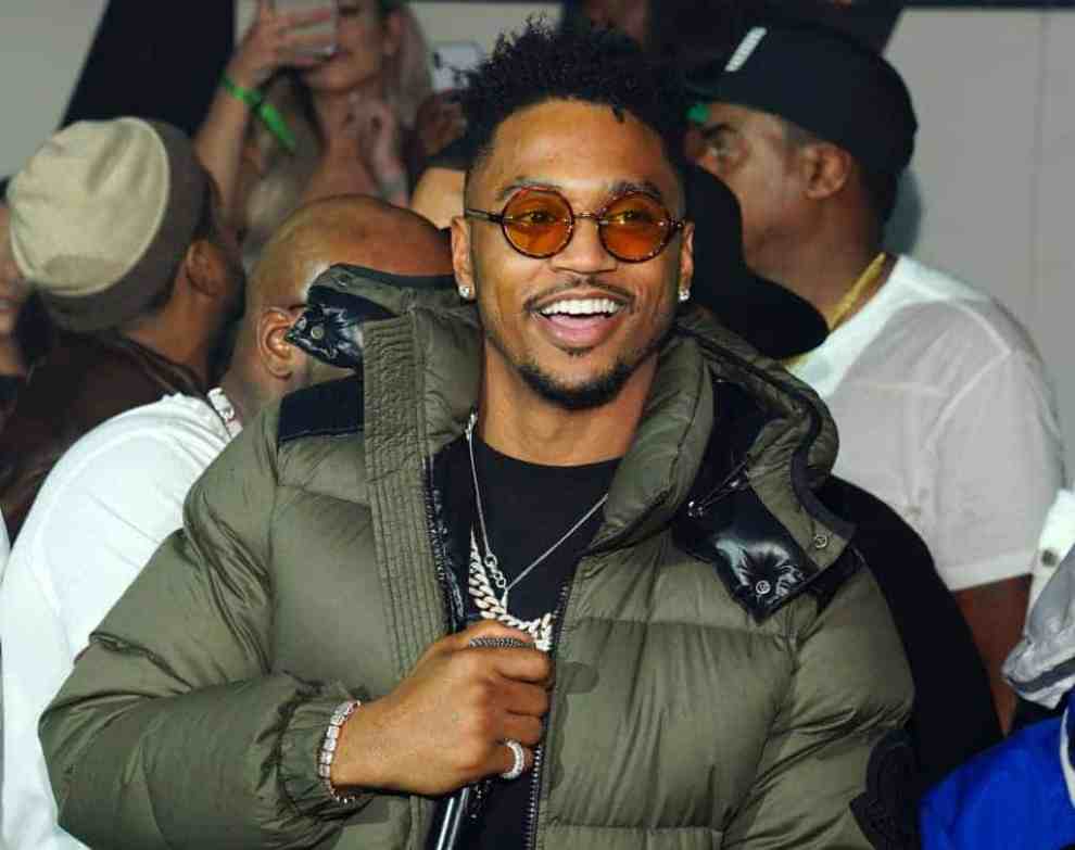 Trey Songz wearing green coat