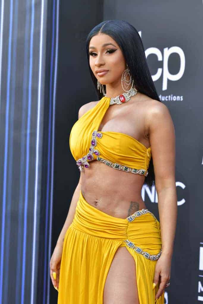 Cardi B wearing yellow dress