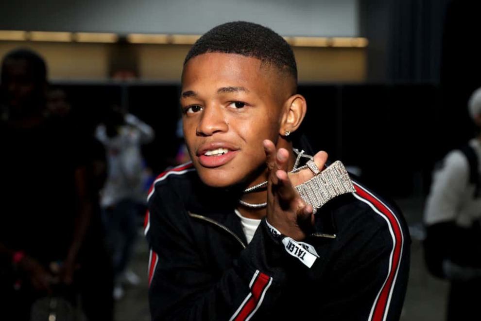 YK Osiris  wearing red and black