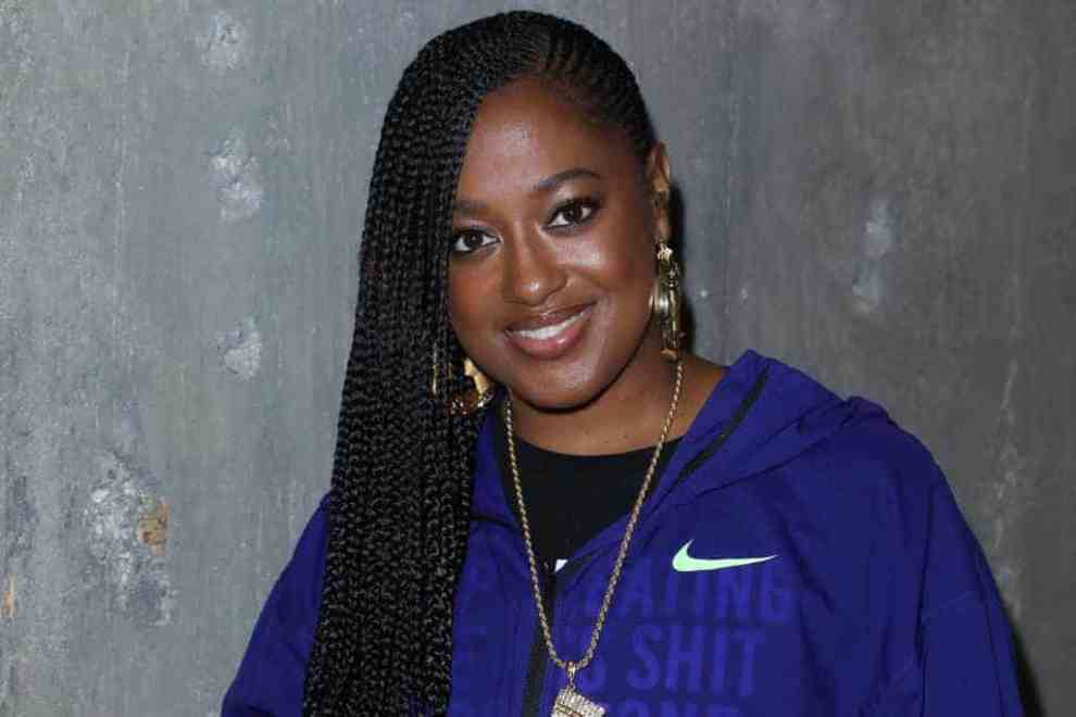 Rapsody wearing purple
