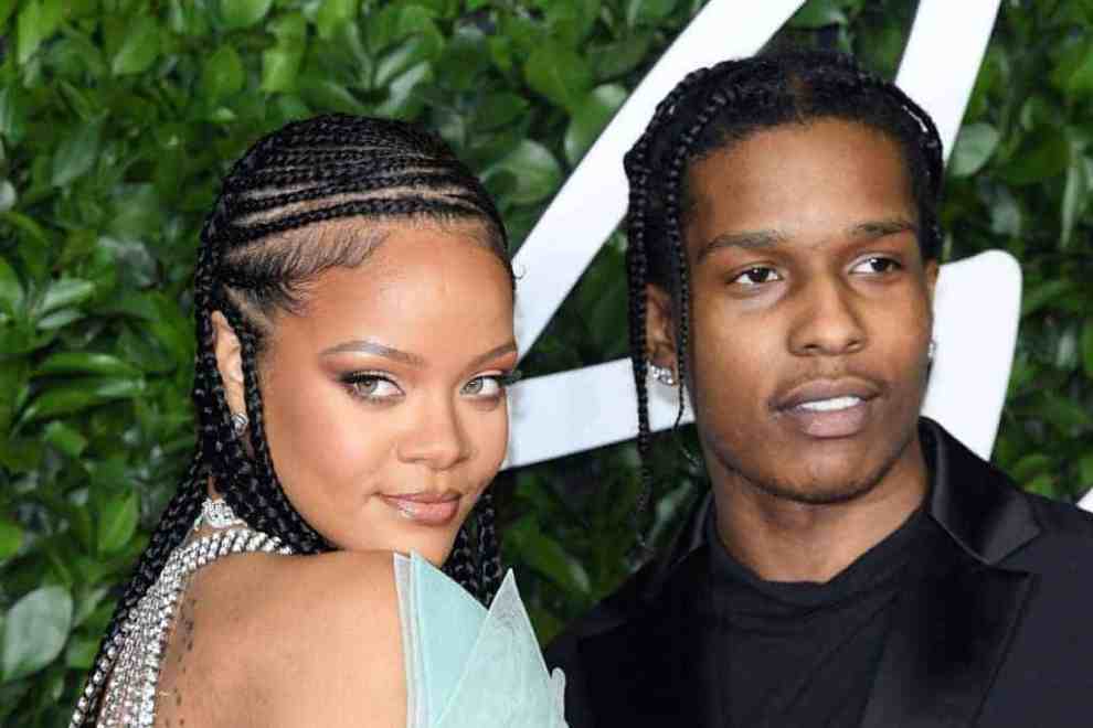 Rihanna and A$AP Rocky smiling at the camera