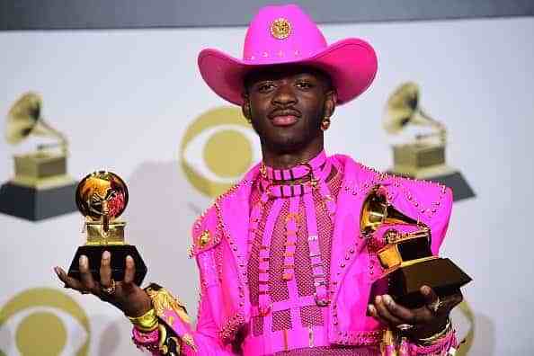 US rapper Lil Nas X poses in the press room with the awards for Best Music Video and Best Pop Duo/Group Performance during the 62nd Annual Grammy Awards on January 26