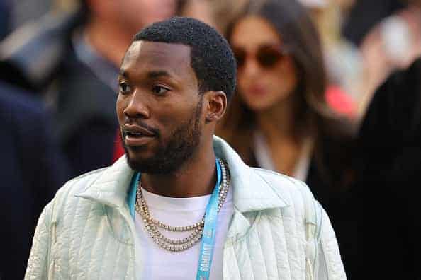 Meek Mill looks on before Super Bowl LIV at Hard Rock Stadium
