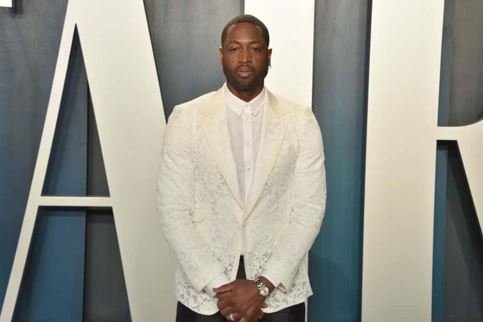 Dwyane Wade wearing a white suit