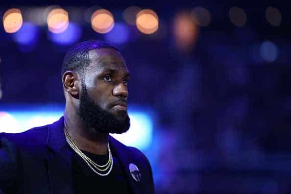 LeBron James #23 of the Los Angeles Lakers stands on the court injured during a time out in their game against the Golden State Warriors at Chase Center on February 27