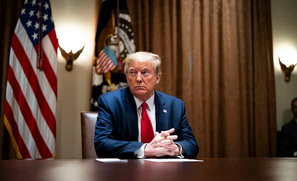 President Donald Trump listens during a meeting with healthcare executives in the Cabinet Room of the White House April 14