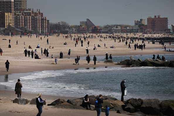 People keep their personal distance as they enjoy a spring afternoon at Brooklyn's Coney Island on April 25