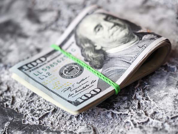 U.S. one-hundred dollar bills are arranged for a photograph in Hong Kong