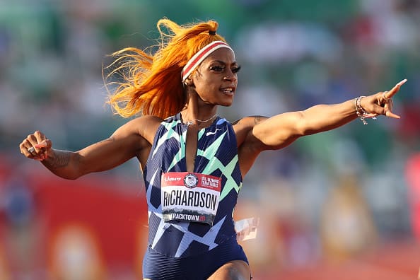 Sha'Carri Richardson runs and celebrates in the Women's 100 Meter semifinal on day 2 of the 2020 U.S. Olympic Track & Field Team Trials at Hayward Field on June 19