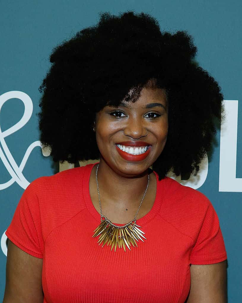 Akilah Hughes wearing a red dress